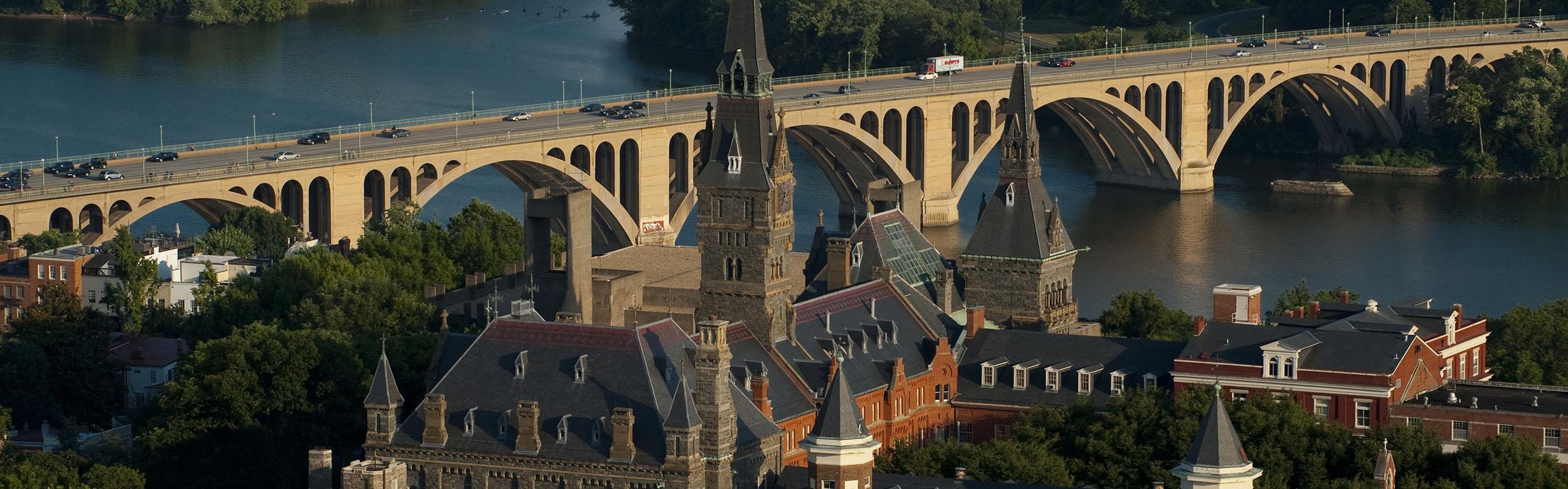 Aerial view of Georgetown campus with the Key Bridge and Potomac River in the background